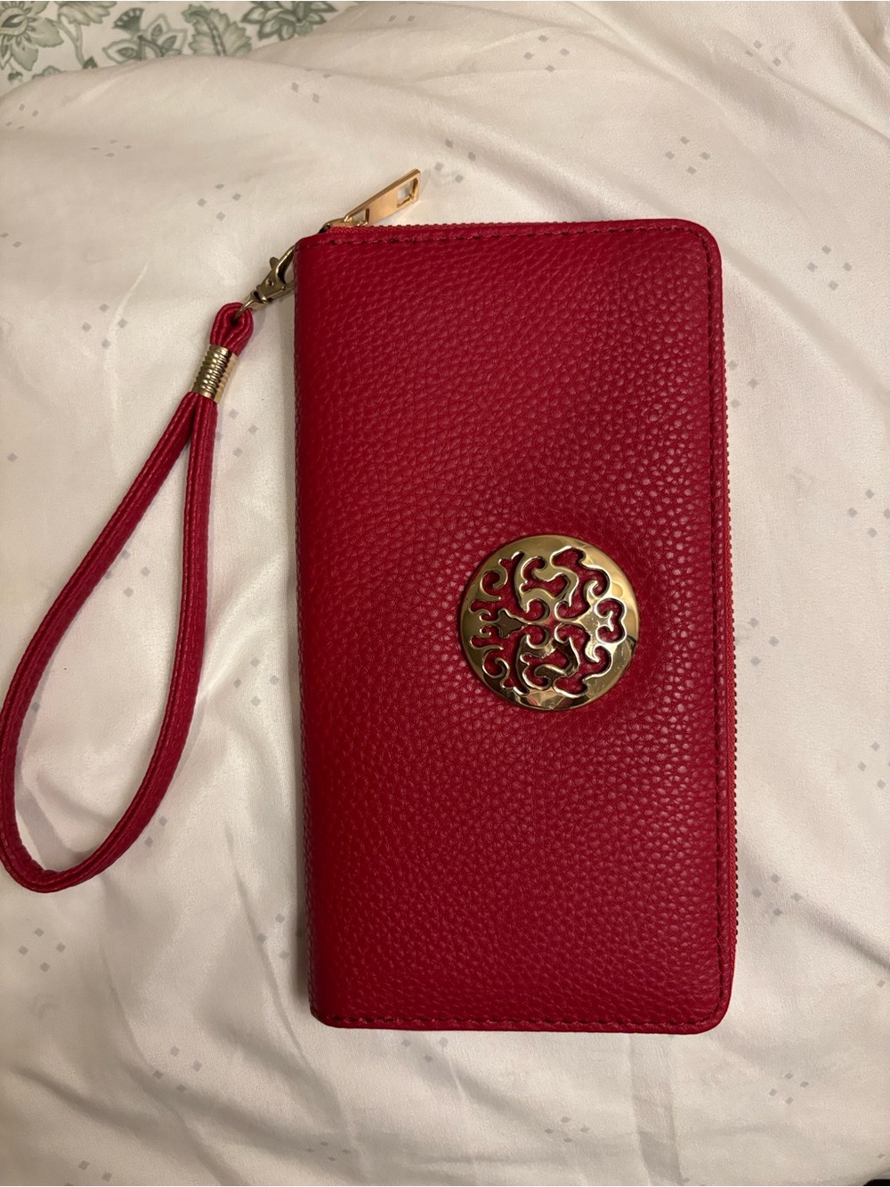 Red Zip-Around Wristlet Wallet with Decorative Gold Emblem